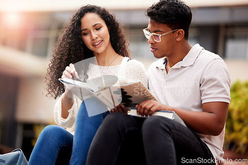 Image of Reading, university and man and woman study with book on campus for learning, knowledge and studying. Education, friends and male and female students with textbook for information, project or college