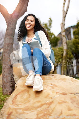 Image of Outdoor, university and portrait of woman with book on campus for learning, knowledge and studying. Education, college and happy female student laugh with textbook for information, research or lesson