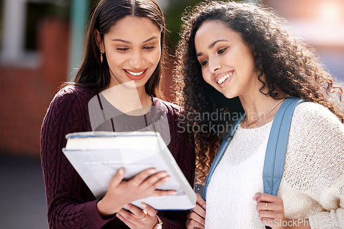 Image of Reading, university and women with book on campus for learning, knowledge and studying. Education, friendship and happy female students with textbook for information, research and college lesson