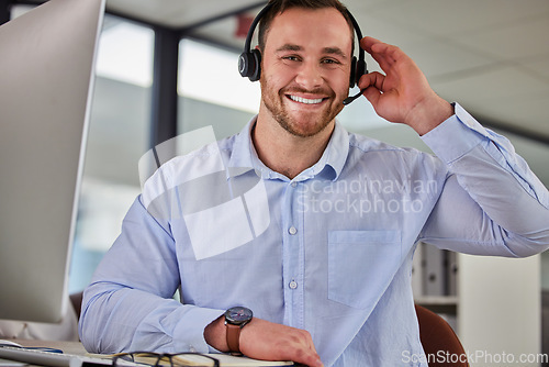 Image of Business man, crm and sales portrait at a call center company with phone consultation and smile. Telemarketing, web consulting and customer service with contact us work of male employee with help