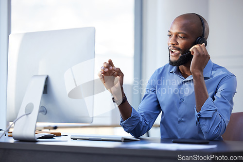 Image of Black man, call center and phone consultation with web support and customer service in office. Computer help, contact us and telemarketing job of a African male employee with communication at work