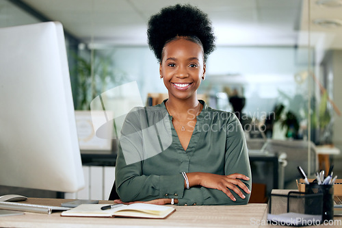 Image of Portrait of confident black woman at desk with smile, computer and African entrepreneur with pride. Happy face of businesswoman in office, small business startup and receptionist at management agency