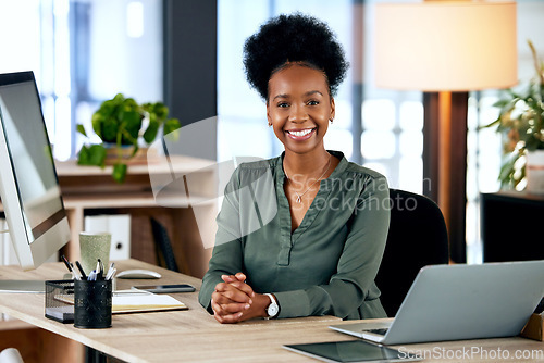 Image of Portrait of happy black woman at desk with computer, smile and African entrepreneur with pride and tech. Confident businesswoman in office, small business startup and ceo at online management agency.