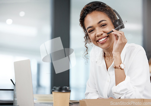 Image of Consultant, portrait of woman with headset and with laptop at her desk in a office of her workplace. Customer service or call center, online communication and female person for crm or telemarketing