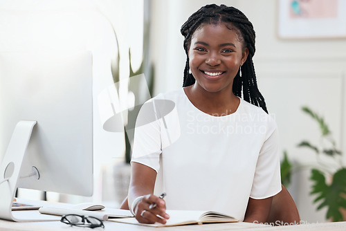 Image of Portrait of black woman at desk with computer, smile and online research for small business administration. African businesswoman in office with confidence in planning schedule, proposal or report.