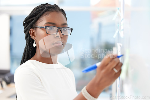 Image of Writing, strategy and black woman with happiness at board planning a business analyst project. African female person, focus and professional with staff notes and moodboard working on company data