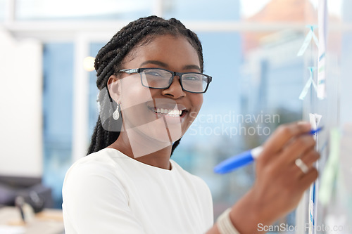 Image of Writing, face and black woman with happiness at board planning a business analyst project. African female person, portrait and professional with staff notes and moodboard working on company data