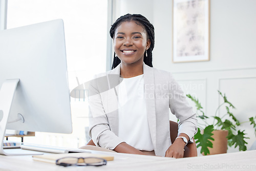 Image of Business, smile and portrait of black woman at desk for corporate career, pride or happiness. Face of professional african female entrepreneur or CEO with success mindset, development and growth