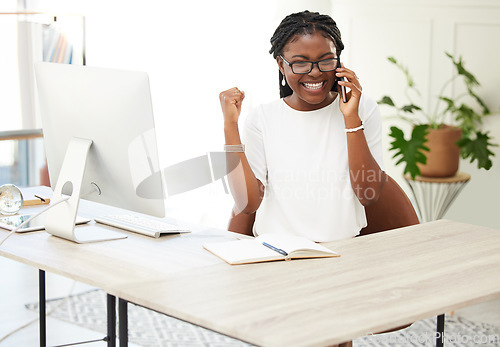 Image of Phone call, fist pump and winner with black woman in office for goal, celebration and bonus. Promotion, achievement and target with excited female employee for communication, networking and contact