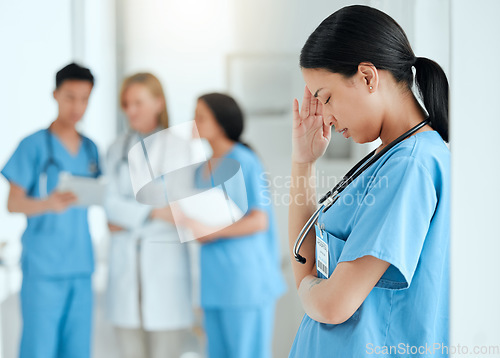 Image of Headache, stress or sad nurse in hospital with burnout, anxiety or fatigue working with medical emergency. Migraine, tired woman or depressed healthcare worker with depression in hospital or clinic