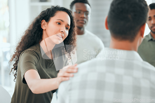 Image of Counseling, woman with hand on man shoulder for comfort and in support center with members. Mental health or depression, group therapy or rehabilitation and people sitting together for recovery