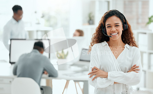 Image of Call center woman, confident portrait and office with arms crossed, leader and pride with team in blurred background. Telemarketing manager, happy and smile for customer service, tech support or crm