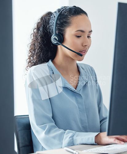 Image of Woman, callcenter and phone call with CRM and headset, communication, technology and working at computer. Customer service, telemarketing or tech support with female consultant and help desk worker