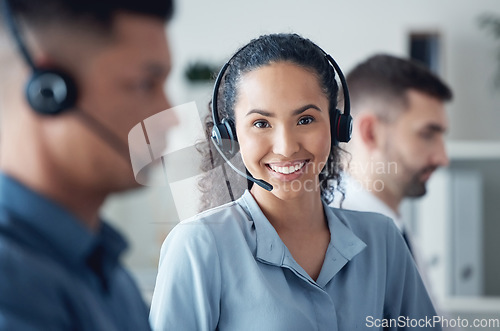 Image of Woman in portrait, callcenter and headset with CRM, communication with technology and contact us. Customer service, telemarketing or tech support, happy female consultant with smile and help desk