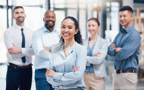 Image of Smile, group of business people in portrait with woman boss, confidence and pride at project management company. Teamwork, commitment and vision, happy team with arms crossed in coworking start up.