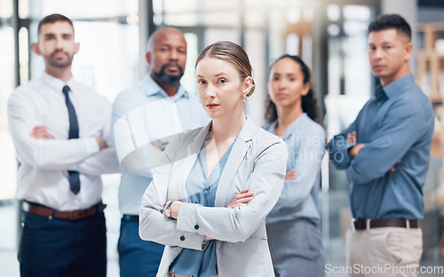 Image of Woman in leadership, group of business people in portrait at startup with confidence and pride at HR company. Teamwork, commitment and vision, human resources team with arms crossed in startup office