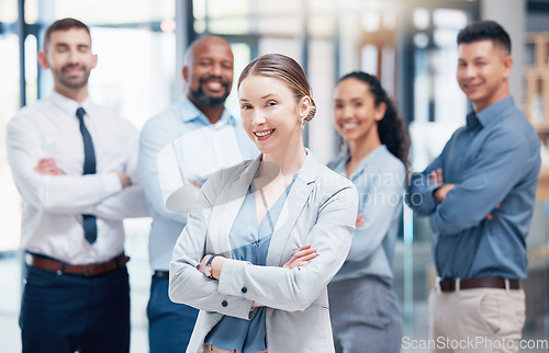 Image of Smile, business people in portrait with woman leader, confidence and pride at project management company. Teamwork, commitment and vision for happy team with boss and arms crossed in coworking office