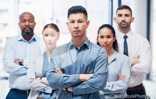 Image of Arms crossed, group of business people in portrait at startup with confidence and pride at project management company. Teamwork, commitment and vision team with leadership mindset in office together.