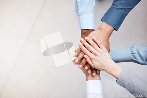 Image of Hands, mockup and a business team in a huddle from above for support, motivation or solidarity. Collaboration, teamwork and space with a group of people or colleagues standing in a circle at work