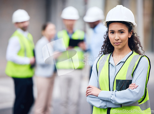Image of Business woman, architect and arms crossed in leadership or project management for construction on site. Portrait of female person, engineer or manager in team planning for industrial architecture