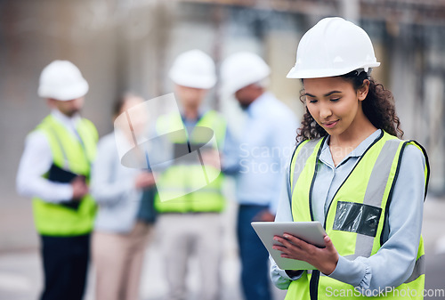 Image of Business woman, architect and tablet in leadership, project management or inspection for construction on site. Female person, engineer or manager with technology and team for industrial architecture