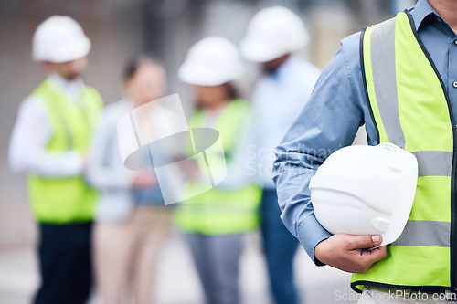 Image of Businessman, architect and helmet for safety in construction, project management or meeting on site. Man holding hard hat for industrial architecture, teamwork or maintenance and building in the city