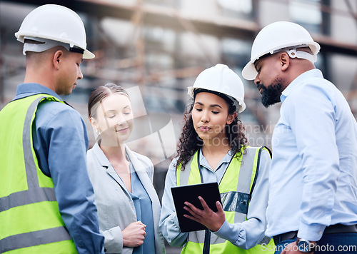 Image of Building, construction and group with architect on tablet, project blueprint or engineering planning for work site. People, teamwork and engineer with technology, strategy or idea for contractor