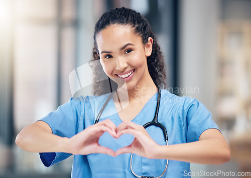 Image of Happy woman, doctor and portrait with heart hands for love in healthcare or life insurance at the hospital. Female person or medical professional showing hand loving emoji, symbol or sign at clinic
