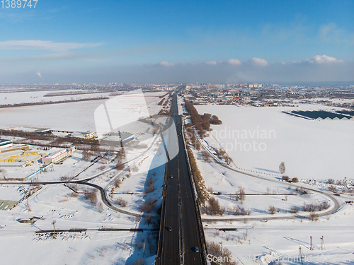 Image of Aerial view of a road in winter landscape