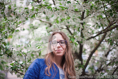 Image of woman portrait in the garden of apple