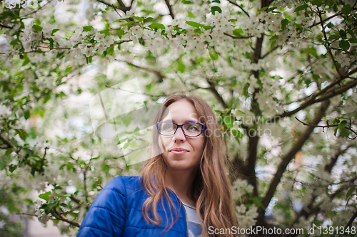 Image of woman portrait in the garden of apple