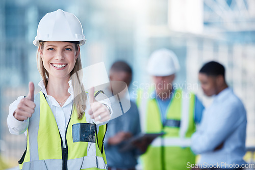 Image of Portrait, thumbs up and construction with a designer woman outdoor on a building site with her team in the background. Management, motivation and confidence with a female architect standing outside