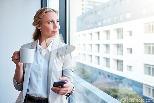 Image of Thinking, coffee and woman with a phone at work for a break, social media or a vision at window. Office, ideas and a corporate employee with tea and a mobile for an app, chat or email in the morning