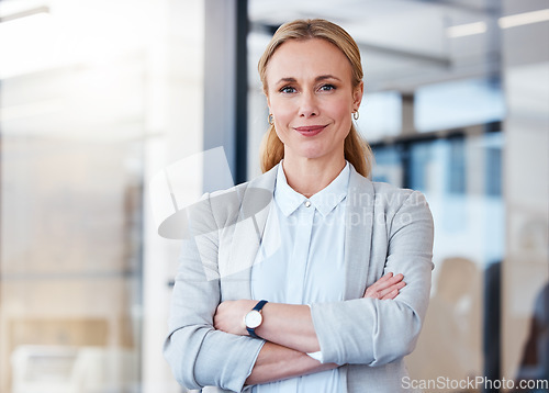 Image of Business woman, portrait smile and arms crossed in confidence for small business management at the office. Happy and confident female person, manager or CEO in corporate leadership at the workplace