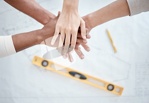 Image of Hands stacked, engineering and people teamwork, collaboration or support above for blueprint construction. Floor plan, together sign and architecture of woman and partner on paper sketch and planning