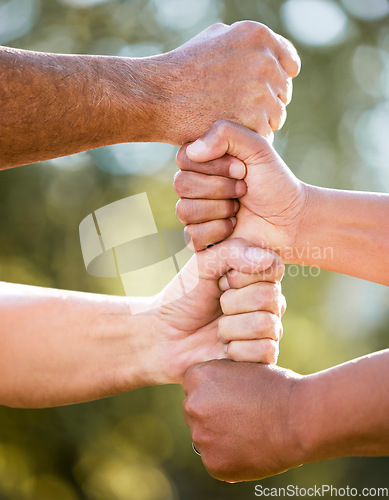 Image of Fist stack, support and team building outdoor with solidarity, power and nature in summer sunshine. Group, people and hands together for trust, teamwork and motivation in park, garden or backyard