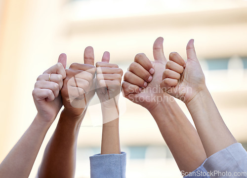 Image of Hands, thumbs up and support with business people to like in agreement, unity or solidarity together outdoor. Thank you, motivation and team building with a group of colleagues or employees outside