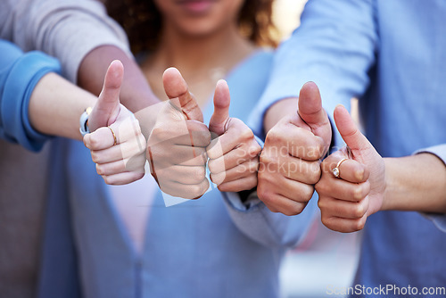 Image of Hands, thumbs up and team building with business people in agreement, unity or solidarity together outdoor. Thank you, motivation and support with a group of colleagues or employees standing outside