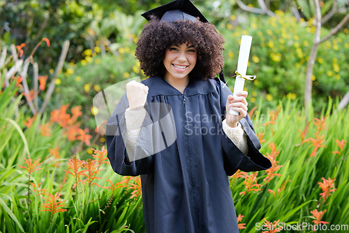 Image of Graduation, celebrate and portrait of woman student or graduate with achievement on university or college campus. Happy, happiness and person with a certificate, scholarship or diploma from education