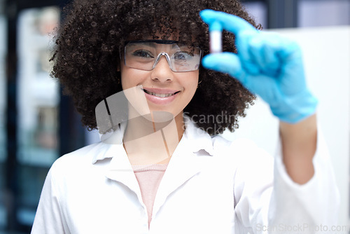 Image of Science, vial and portrait of a female scientist working on research for a project in a lab. Medical innovation, pharmaceutical and woman biology researcher with glasses for discovery in a laboratory