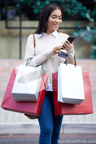 Image of Shopping, retail and woman with phone in city for sale, discount and bargain notification. Fashion store, mall and happy female person on smartphone for purchase, buying and promotion news online