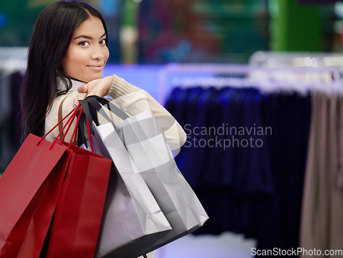 Image of Shopping, retail and portrait of woman with bags in store for sale, discount and bargain for clothing. Fashion deal, mall and face of happy female person with bag for purchase, buying and promotion