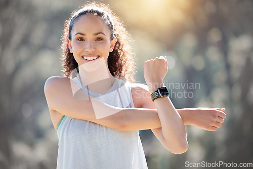 Image of Happy woman, fitness and stretching arms for exercise, workout or training in the nature outdoors. Portrait of fit or active female person smiling in warm up stretch, exercising or healthy wellness