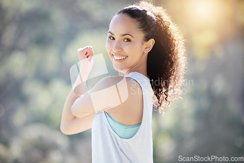 Image of Happy woman, portrait smile and stretching arms for fitness, exercise or outdoor workout in nature. Fit or active female person smiling in warm up stretch, exercising or training for healthy wellness