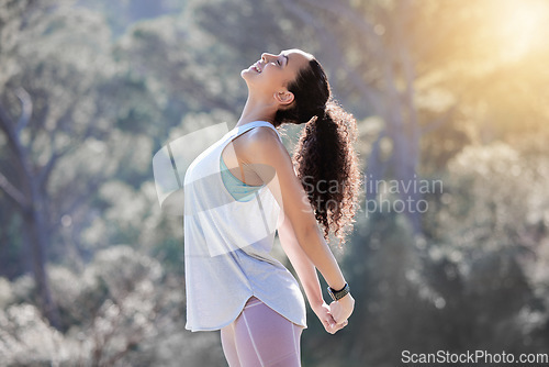 Image of Happy woman, relax and stretching body in fitness, exercise or outdoor workout in nature. Fit, active and sporty female person smiling in warm up stretch, exercising or training for healthy wellness