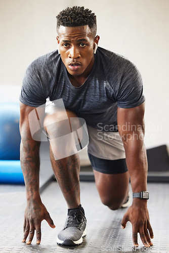 Image of Fitness, exercise and black man in a gym, training and workout goal with wellness, health and breathing. Male person, guy or athlete in a recreation center, sports and commitment with a challenge