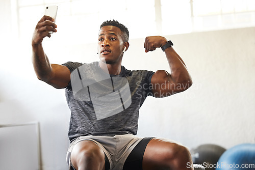 Image of Selfie, muscle flex and man for gym, fitness and workout results, progress and social media update of body goals. Bodybuilder or african person with profile picture, photography and exercise in power