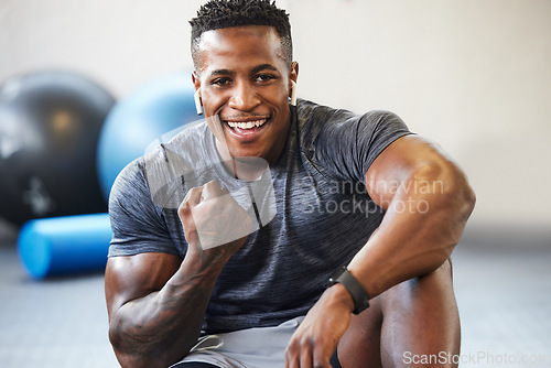 Image of Fitness, cheering and portrait of man in a gym after success or complete workout. Sports, motivation and African male athlete with fist pump for bodybuilding or strength arm exercise in sport center.