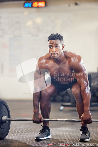 Image of Black man, fitness and bodybuilder weightlifting for workout, exercise or training at the gym. African male person or muscular bodybuilding lifting barbell for strength sports or intense exercising