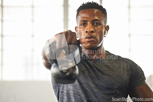 Image of Kettlebell, fitness and black man with gym workout, bodybuilder challenge and training with health and focus. Young athlete or professional person sweating for sports exercise, muscle and power goals